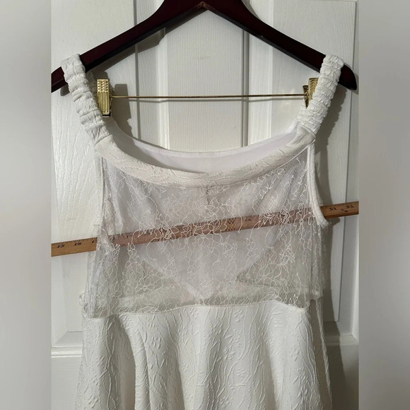 NWOT Free People ALLURING Brooklyn Mini Dress White L Lace Sheer Twirly Pockets - Picture 15 of 16